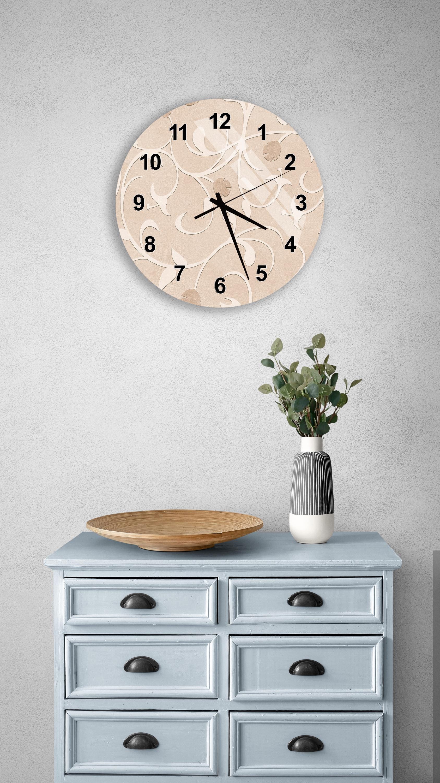a light blue wooden dresser with a round clock mounted on the wall above it. The dresser has six drawers and a vase with greenery on top.