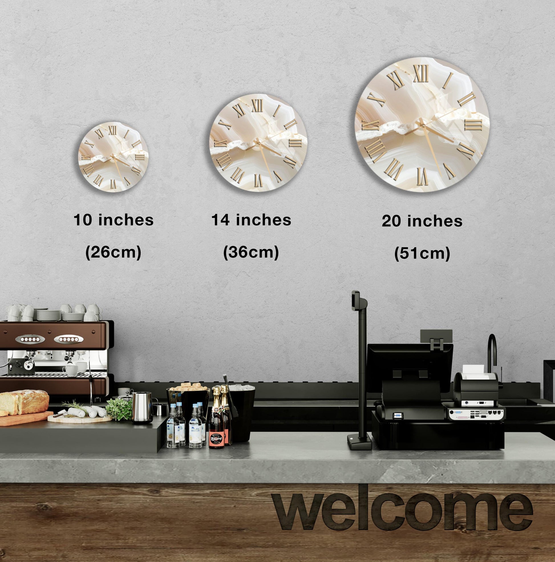 a counter with a cash register, a coffee machine, and a display of various food items. There are three clocks on the wall, each at different sizes, and a welcome sign below the counter.