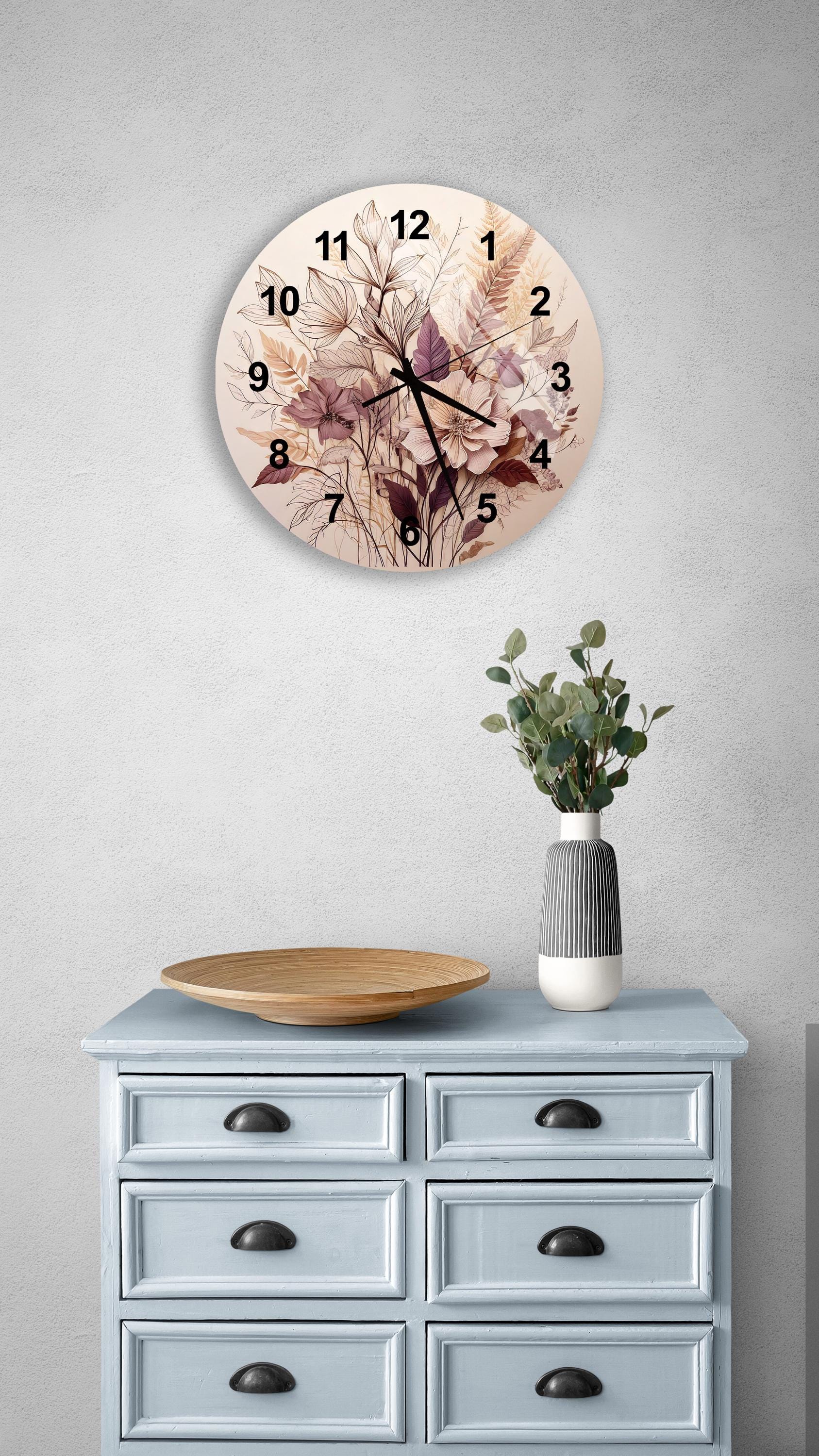 a clock on a wall above a dresser