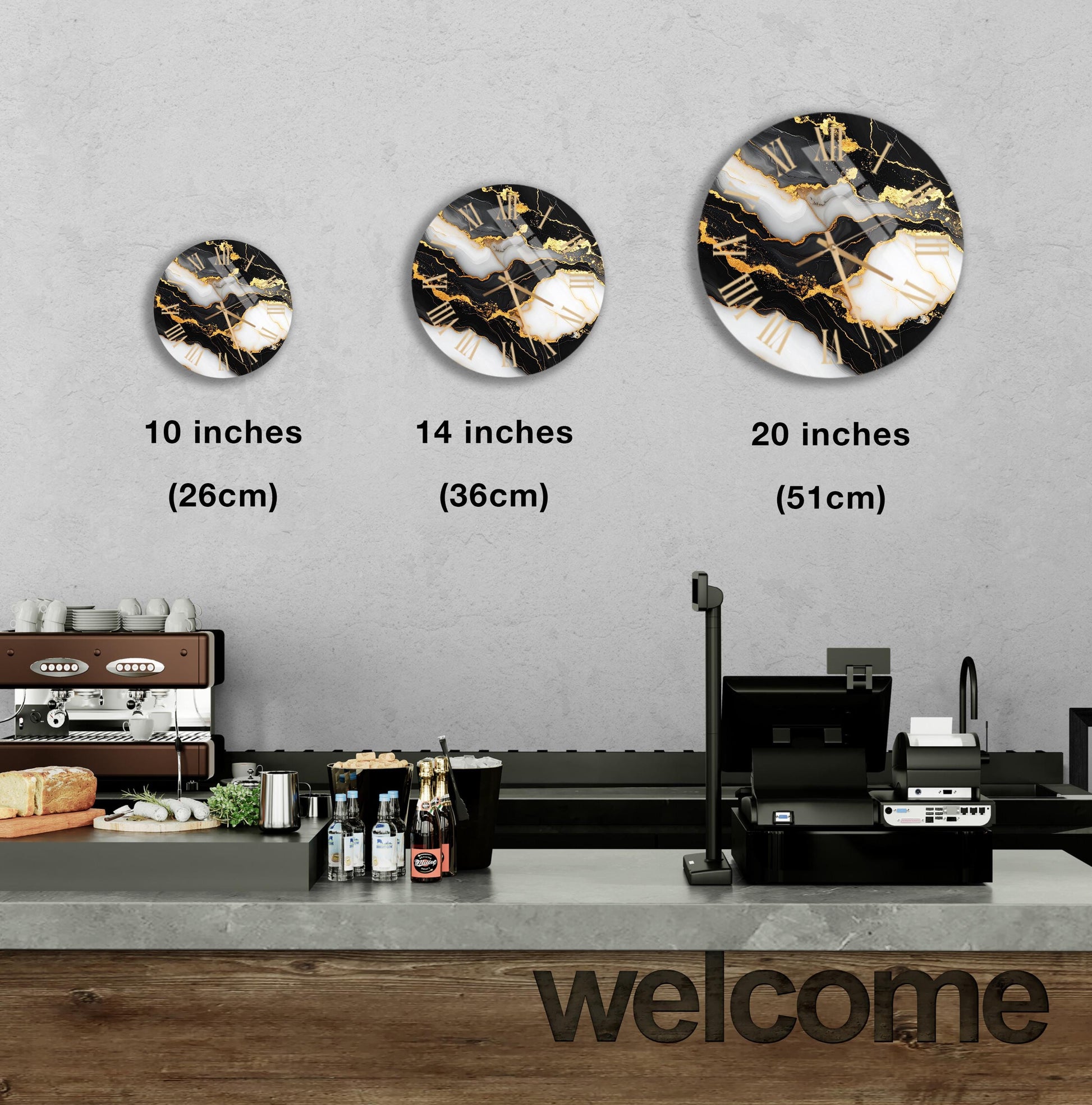 a counter with a cash register, a coffee machine, and a sign that says "welcome". There are three clock designs displayed on the wall, each with a different size and style.
