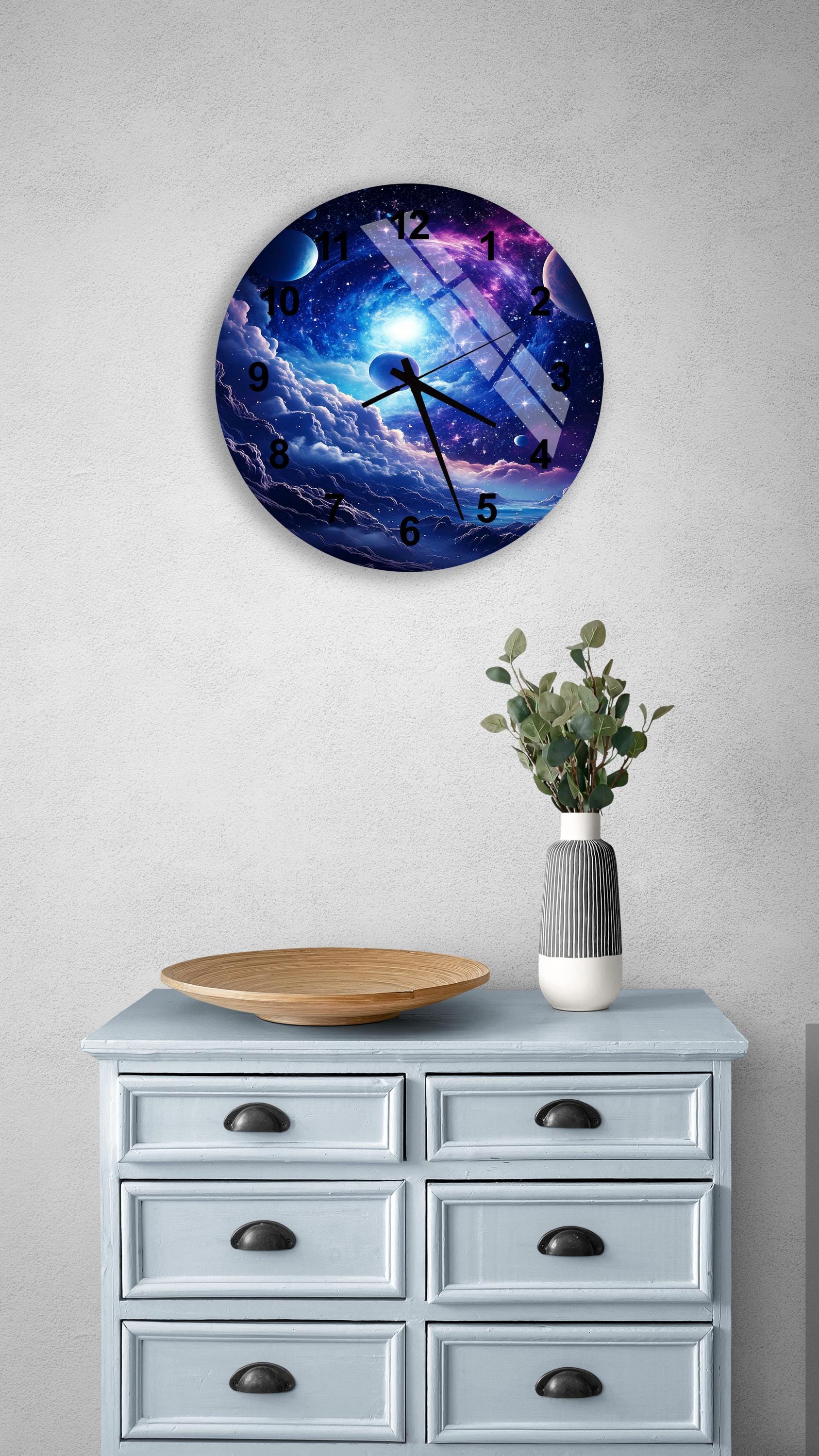 a clock on a wall above a dresser