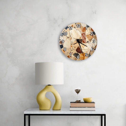 a modern living room with a round wall clock, a yellow lamp, a white table, and a stack of books.
