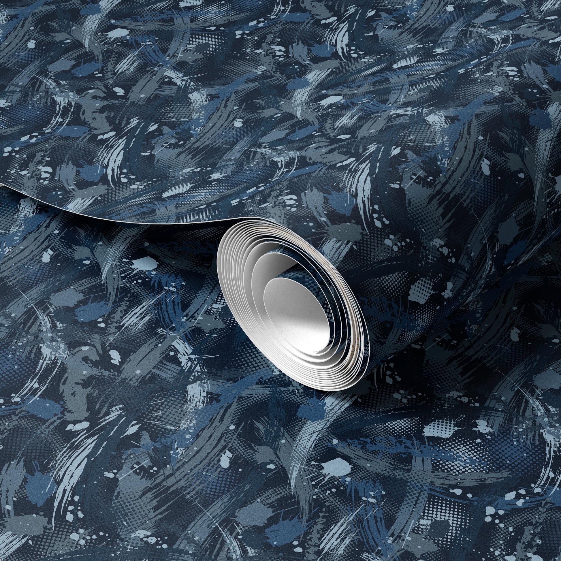 a roll of wallpaper with a blue and white abstract pattern.