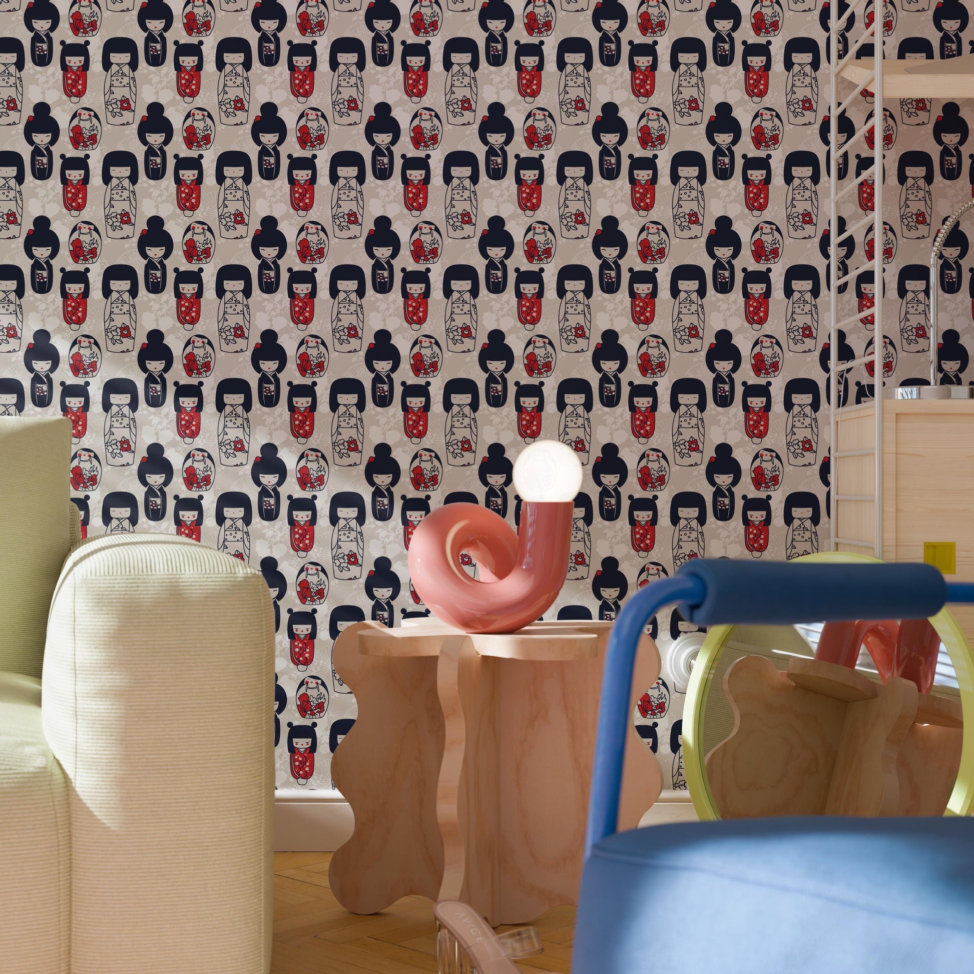 a room with a patterned wallpaper, a pink sculpture on a wooden table, and a blue chair.