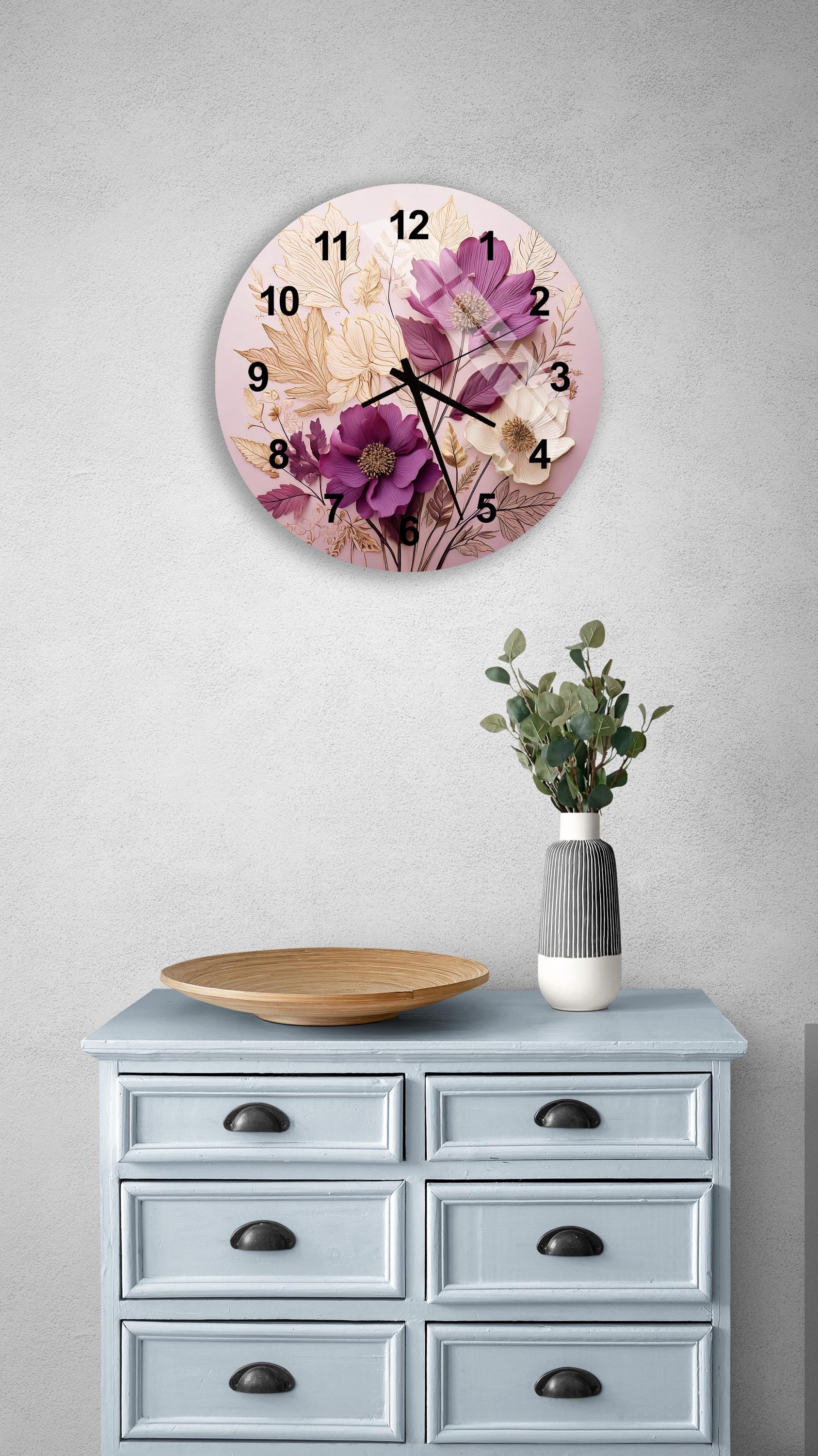 a clock on a wall above a dresser