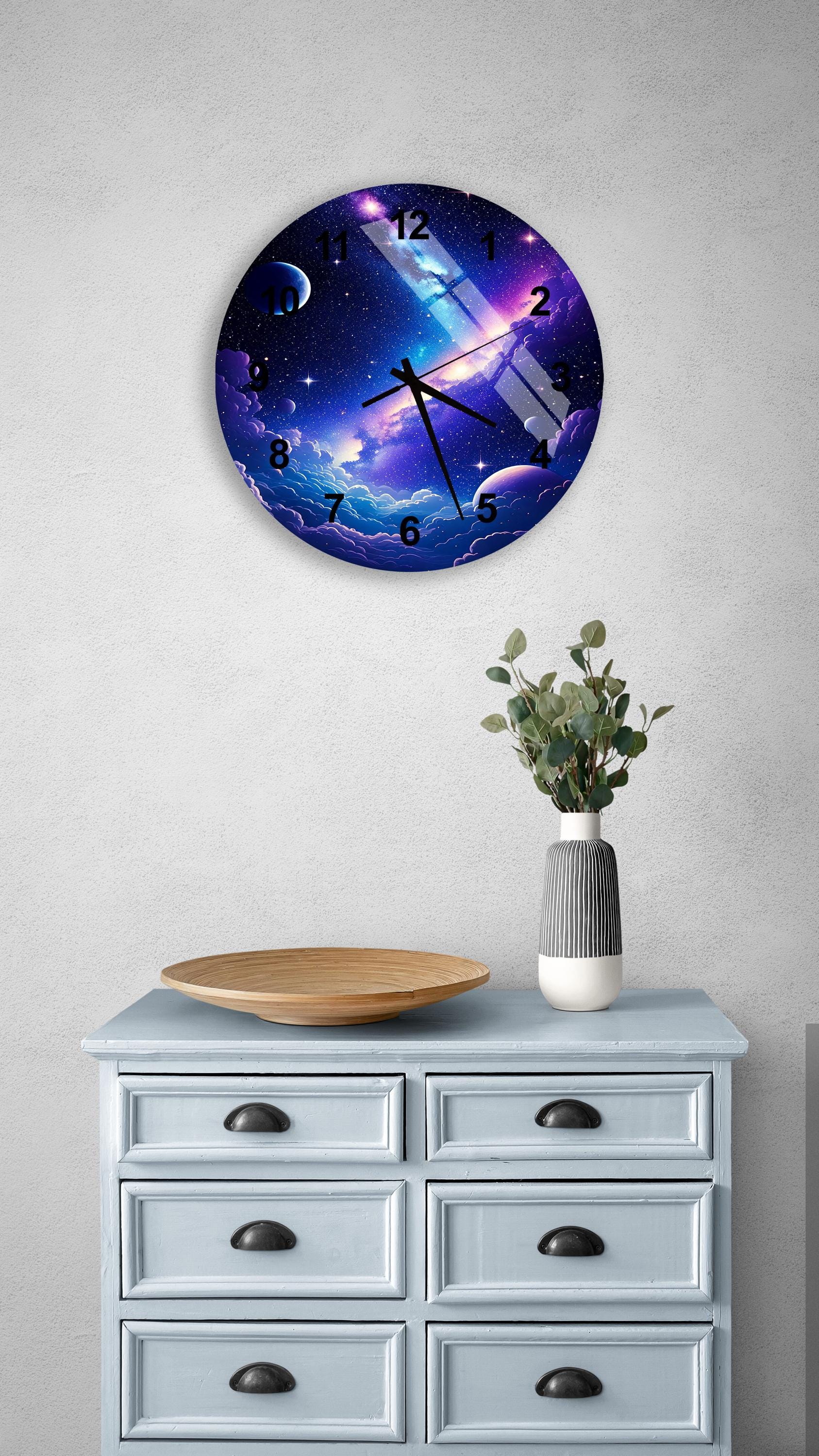a clock on a wall above a dresser