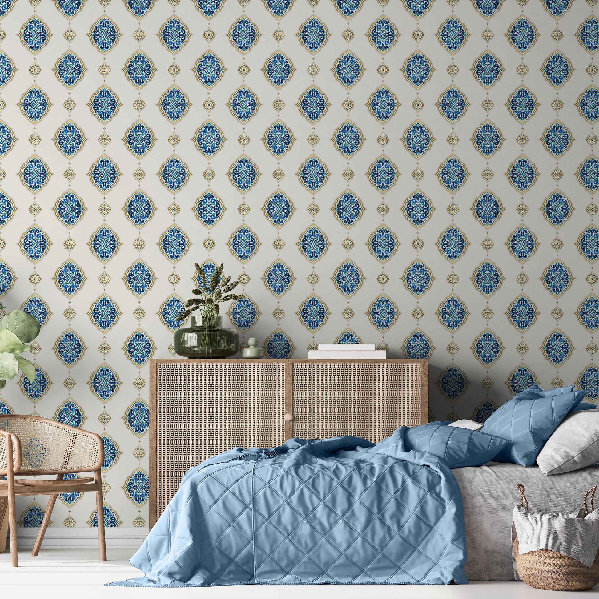 a bedroom with a patterned wallpaper, a wooden dresser, a bed with blue bedding, and a woven basket.