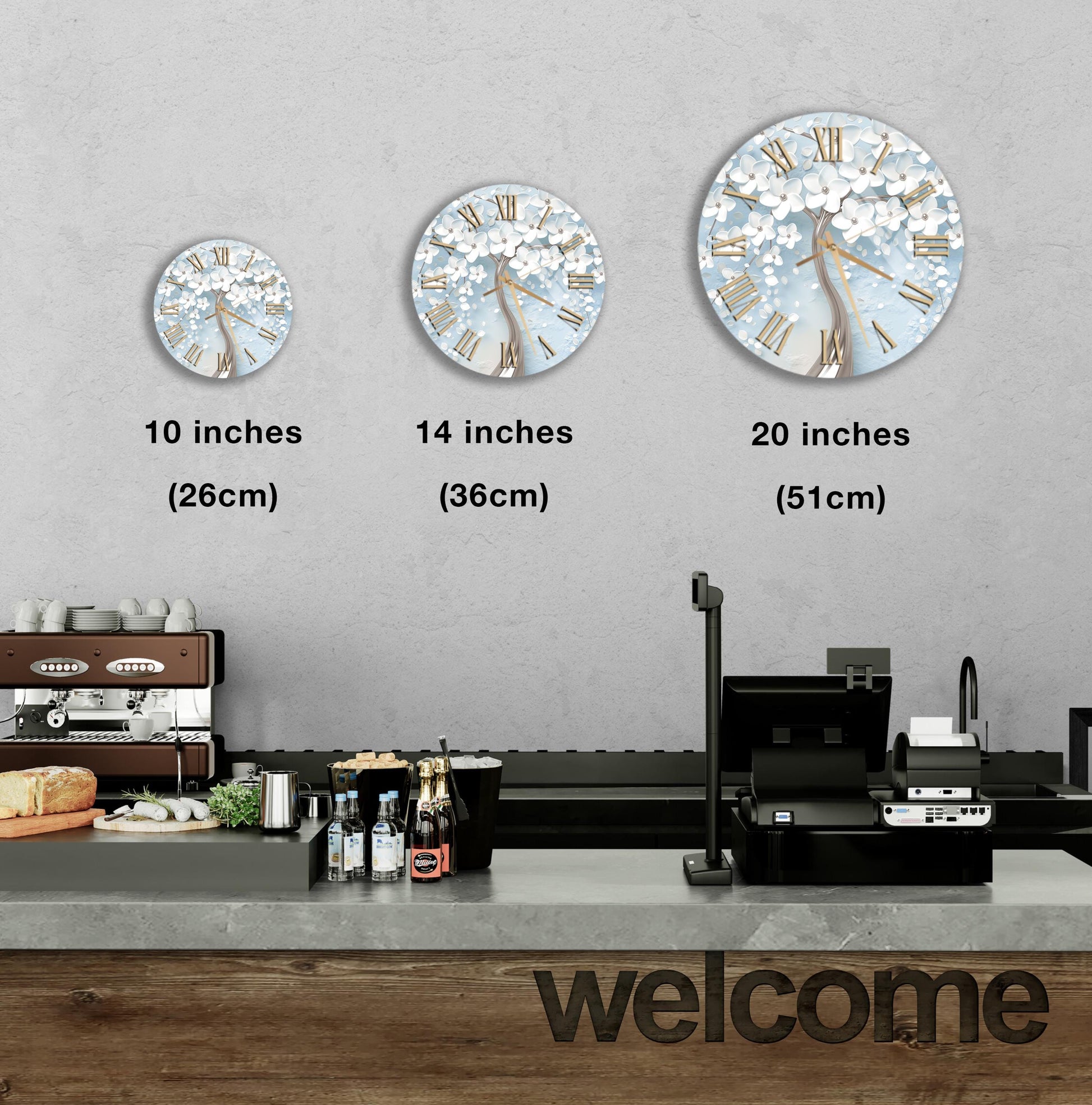 a counter with a cash register, a coffee machine, and a display of various items such as bottles and a cake. There are three clocks on the wall, each with a different size and design, and a welcome sign is visible below the counter.