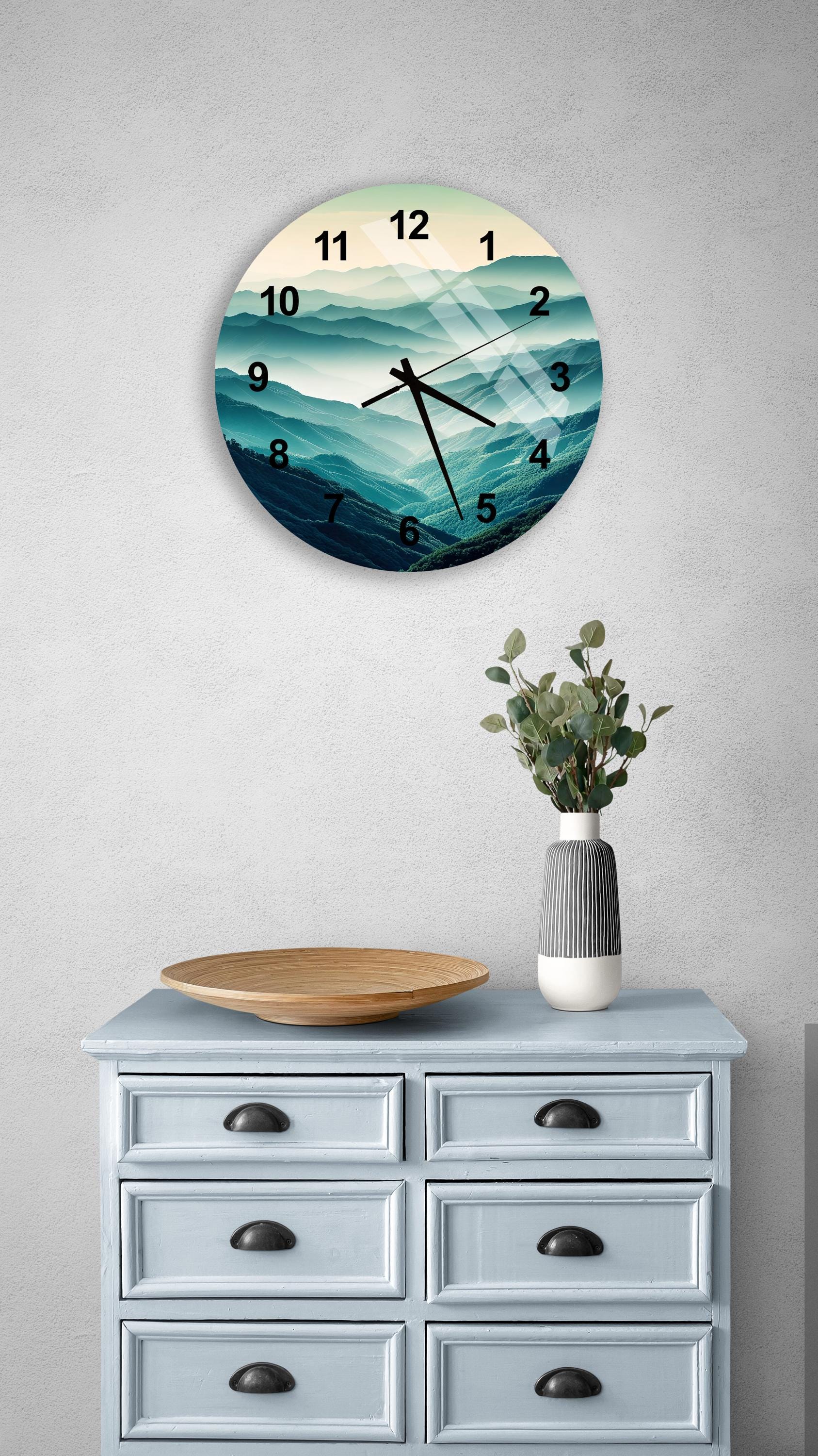 a clock on a wall above a dresser