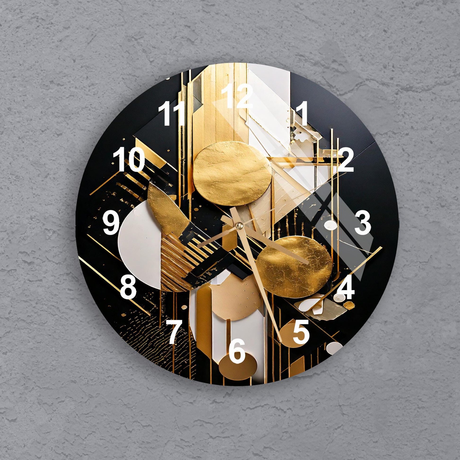 a black and gold clock on a gray wall