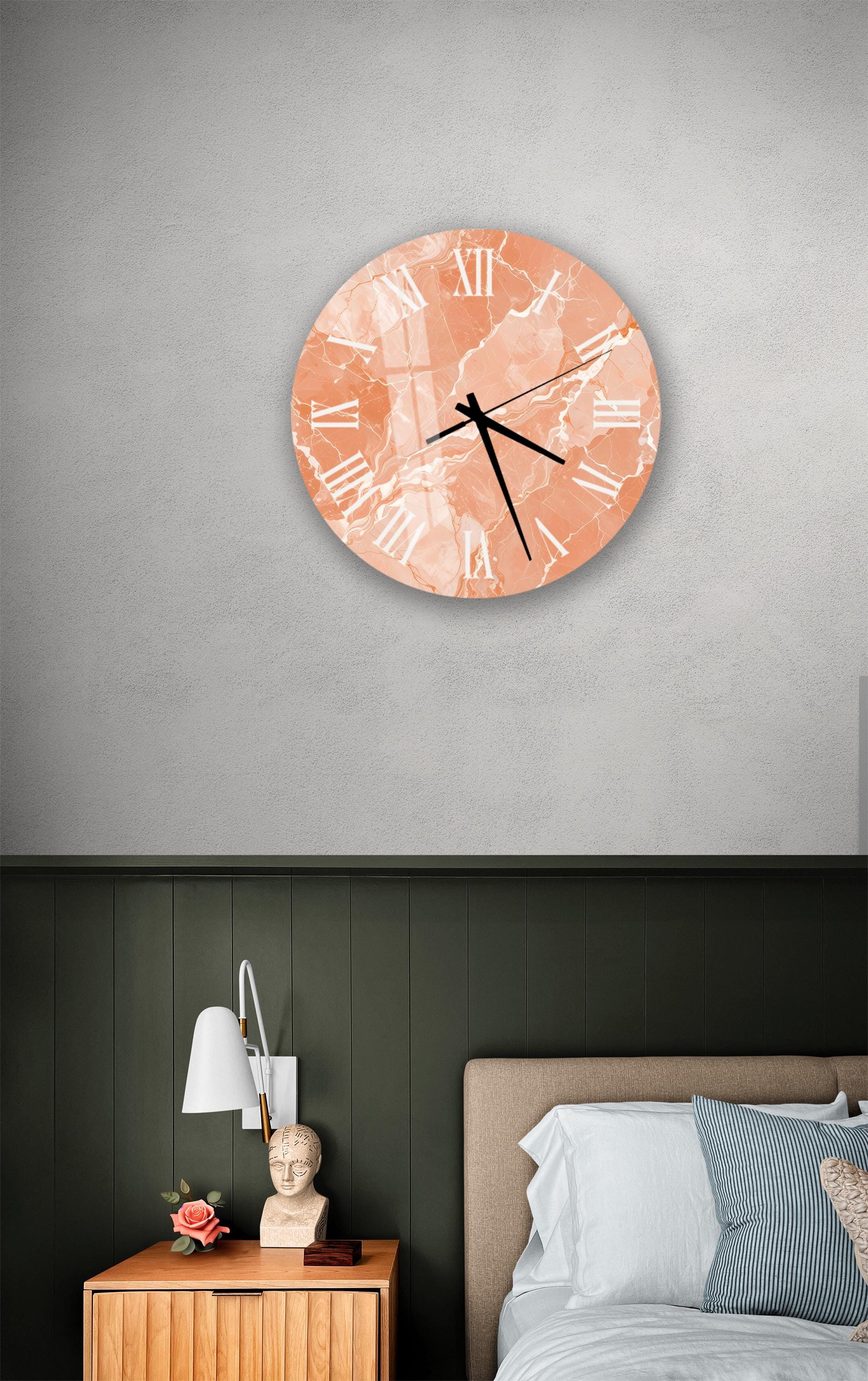 a bedroom setting with a round wall clock displaying the time as 12:30, and a wooden nightstand with a lamp and a vase of flowers.