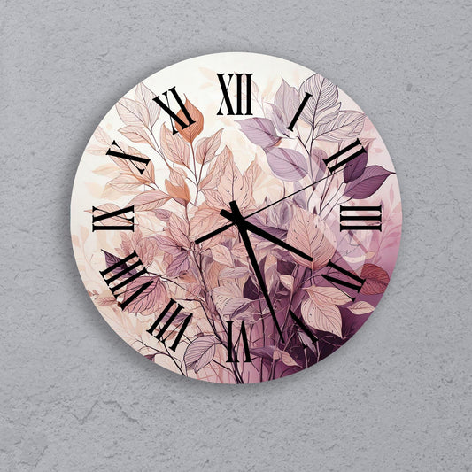 a clock with a painting of leaves on it