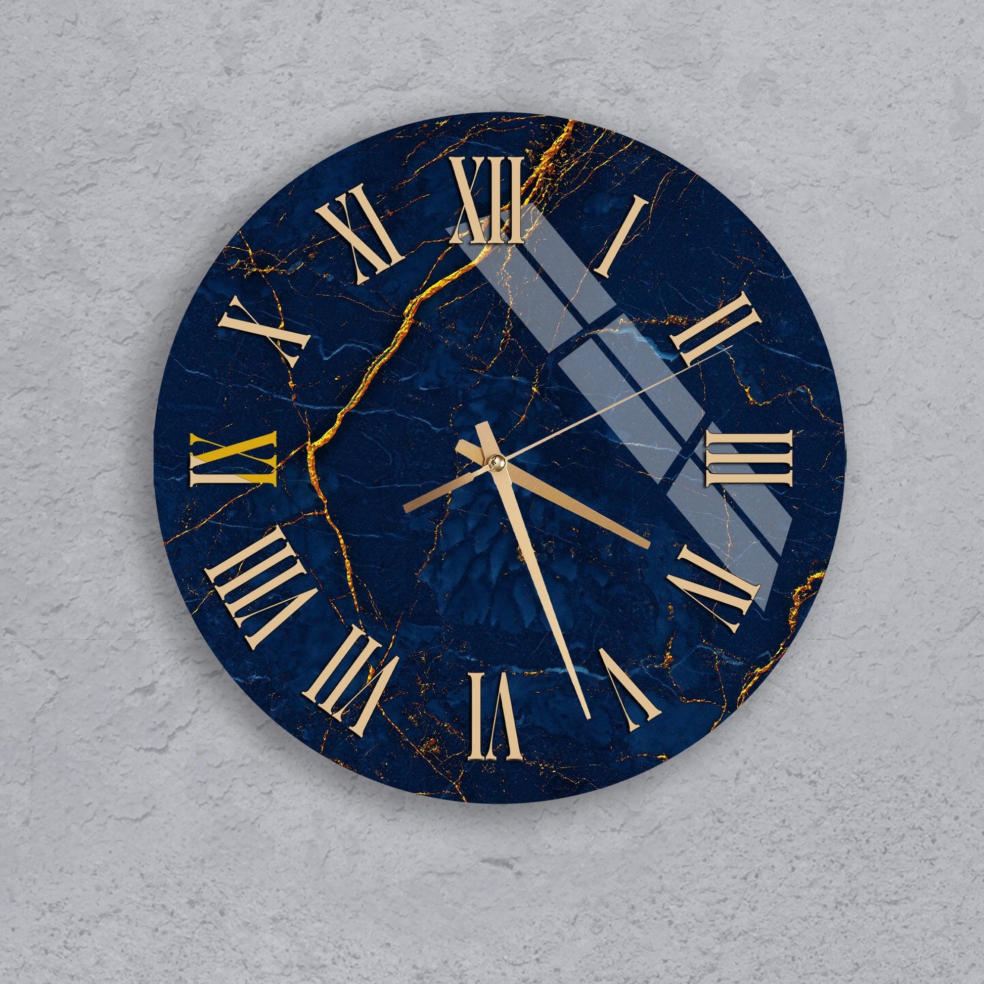 A round wall clock with a blue marble-like finish and gold Roman numerals.