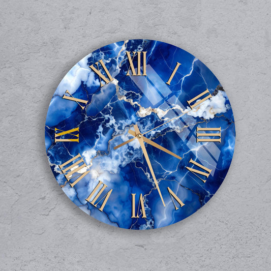 A round clock with a blue marble-like design and gold Roman numerals.