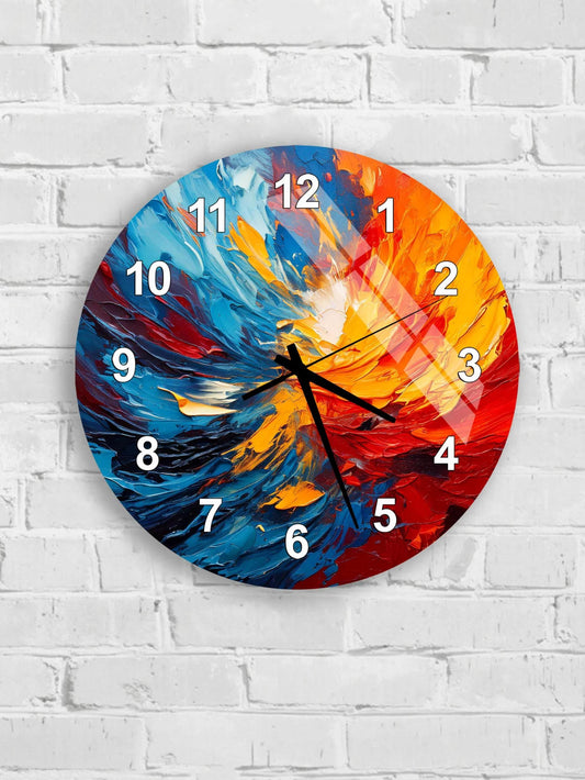 A colorful wall clock with a vibrant abstract design, mounted on a white brick wall.