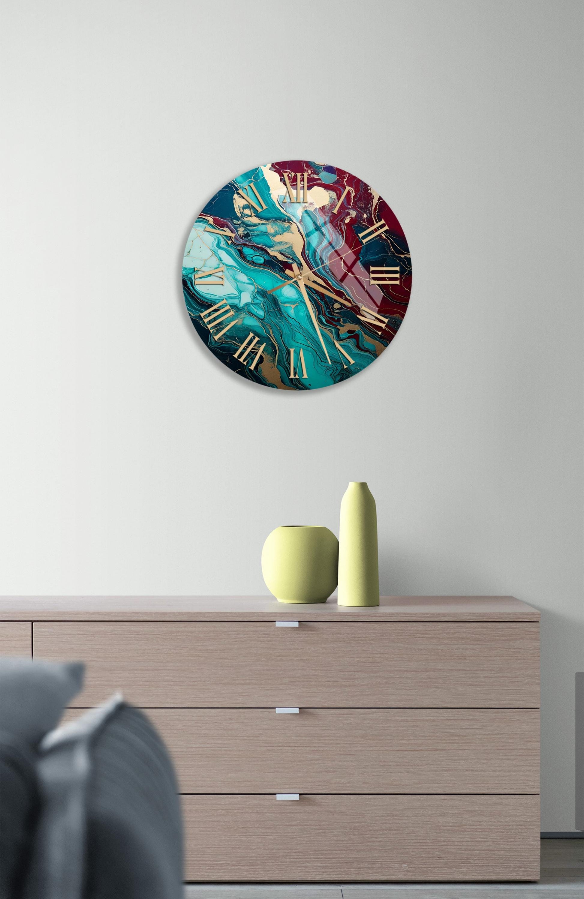 a clock on a wall above a dresser