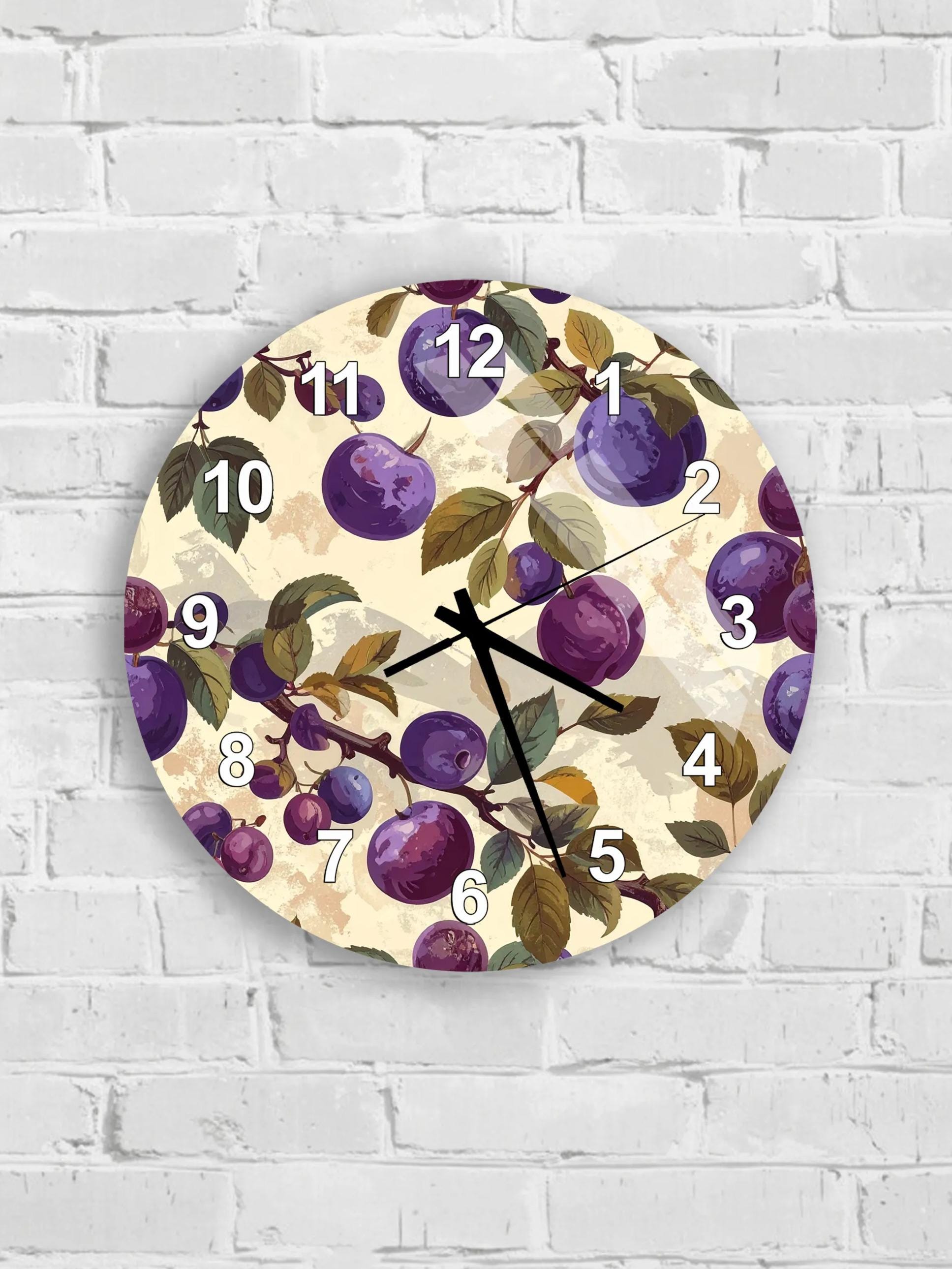 A round wall clock with a floral design featuring purple grapes and leaves.