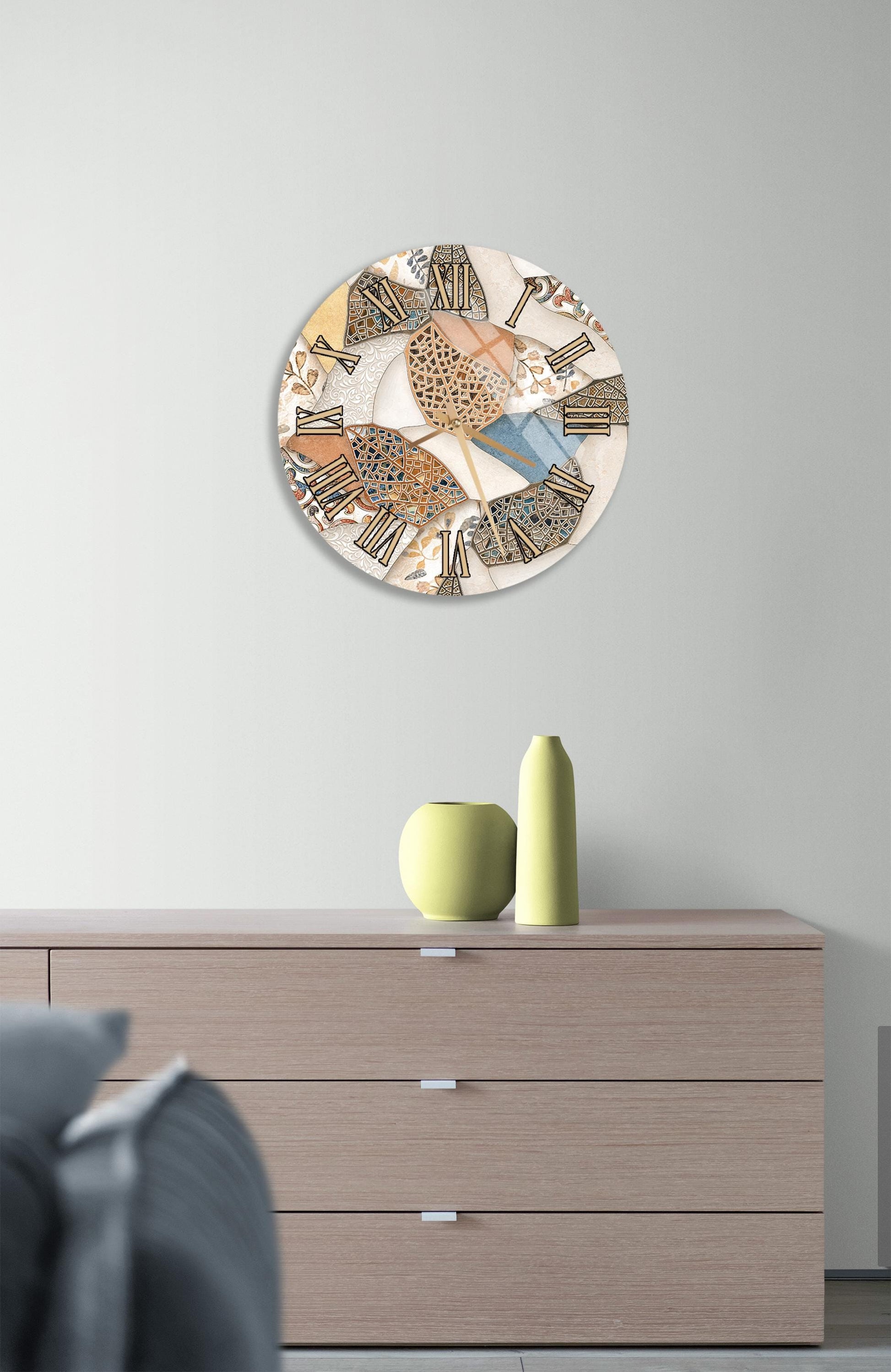 a modern living room with a wooden dresser, a round clock with a colorful abstract design, and a gray couch.