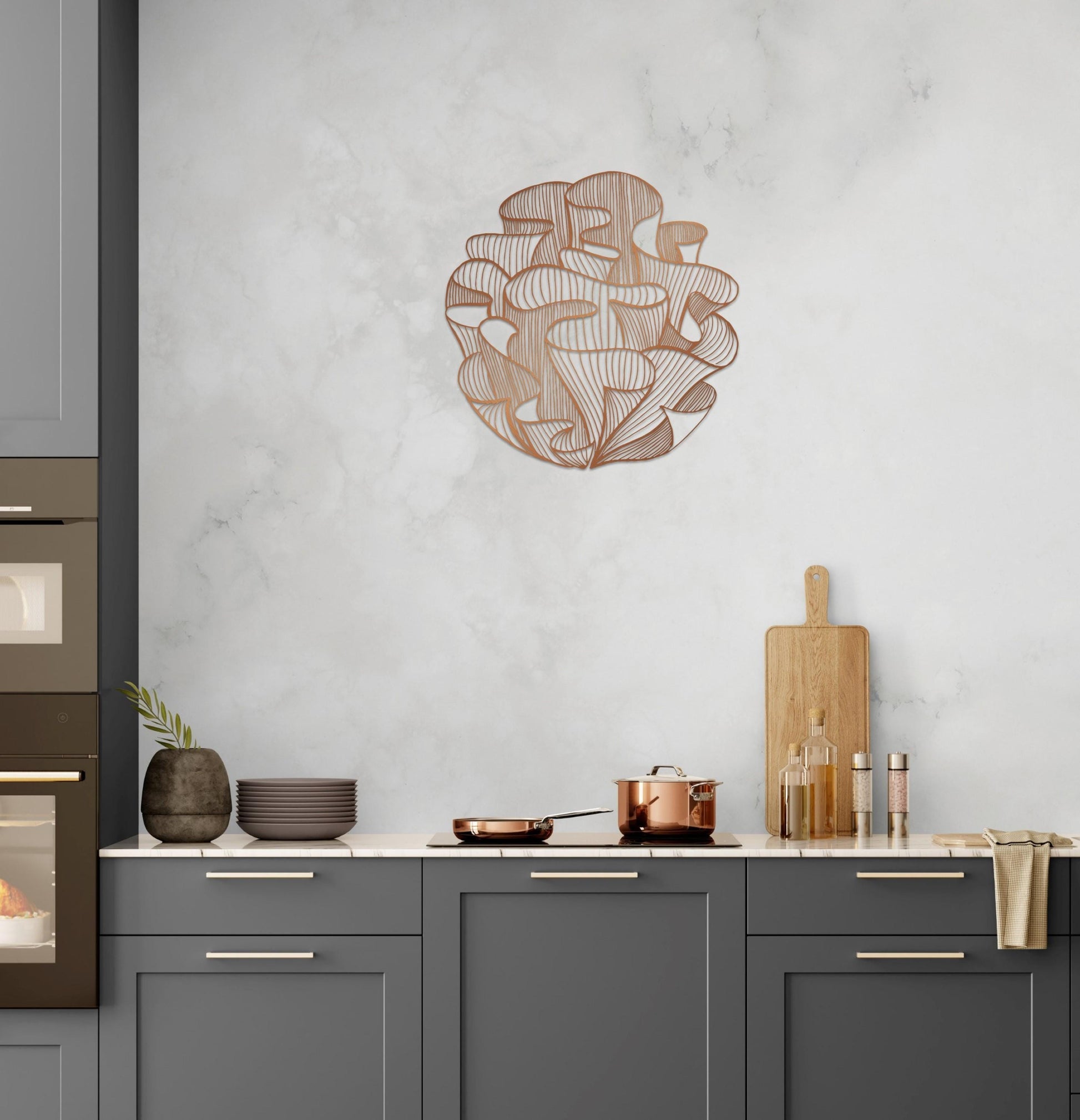 a kitchen with gray cabinets and a marble wall