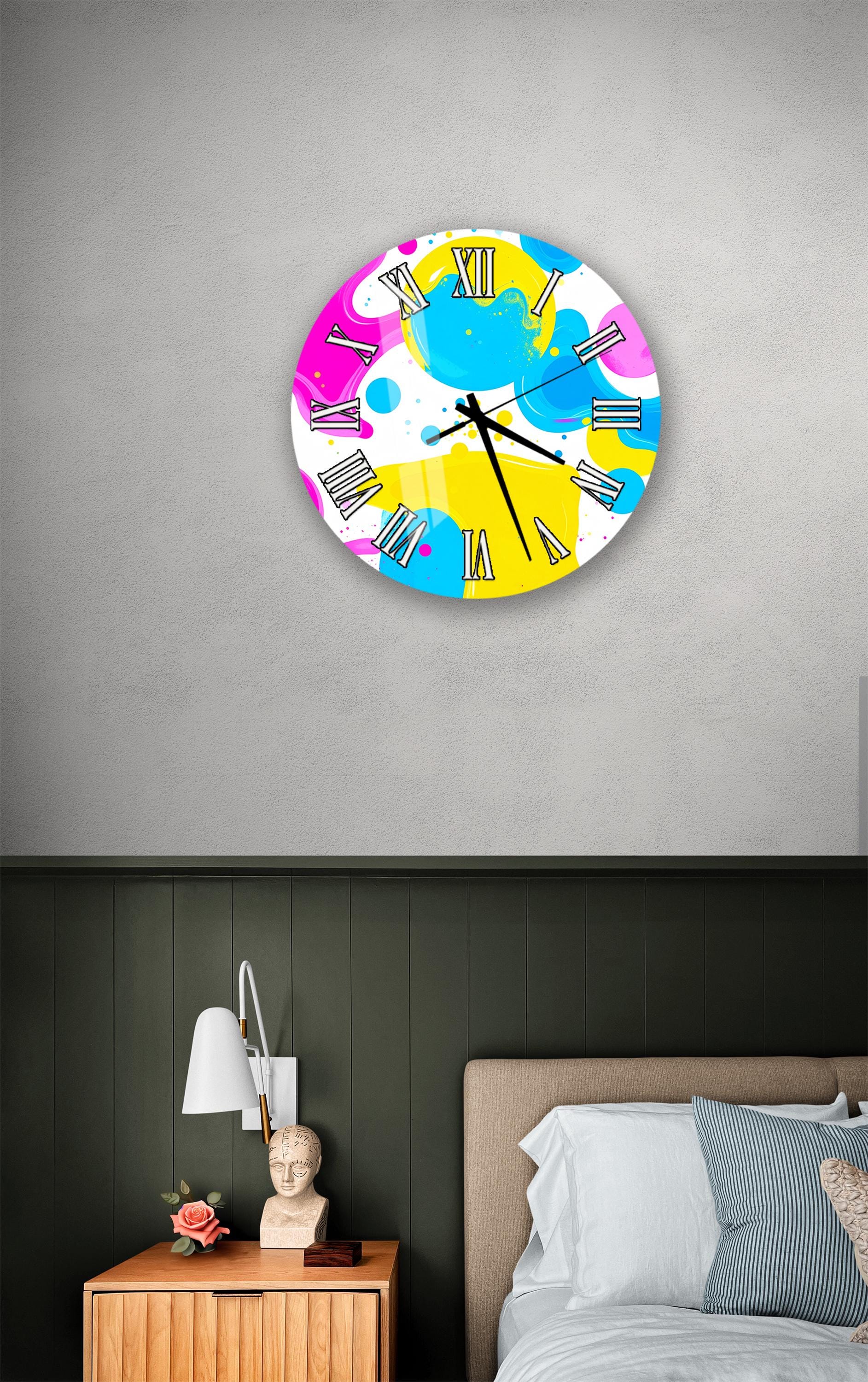 a bedroom setting with a colorful wall clock hanging above a bed.