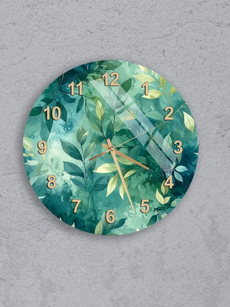 six round wall clocks with a green leaf design, arranged in a grid pattern on a gray background.