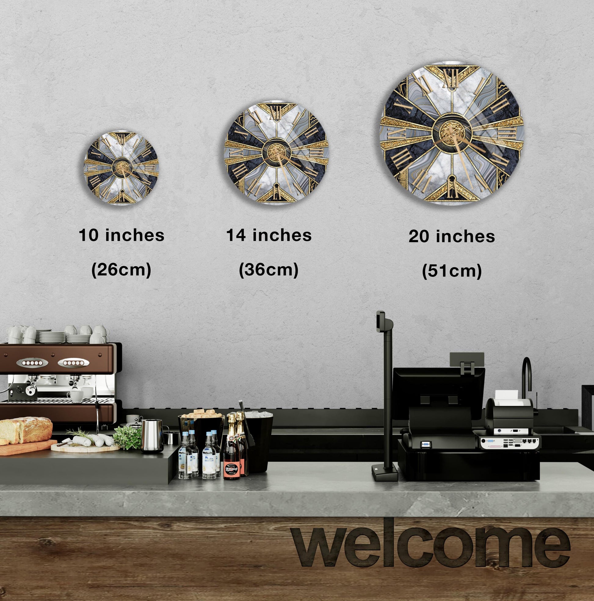 a wall with three clock designs of different sizes, and there is a counter with a cash register and some food items on it.