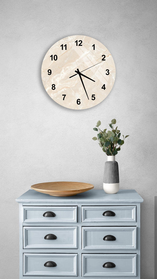a light blue wooden dresser with a round clock mounted on the wall above it. The dresser has six drawers and a vase with greenery on top.