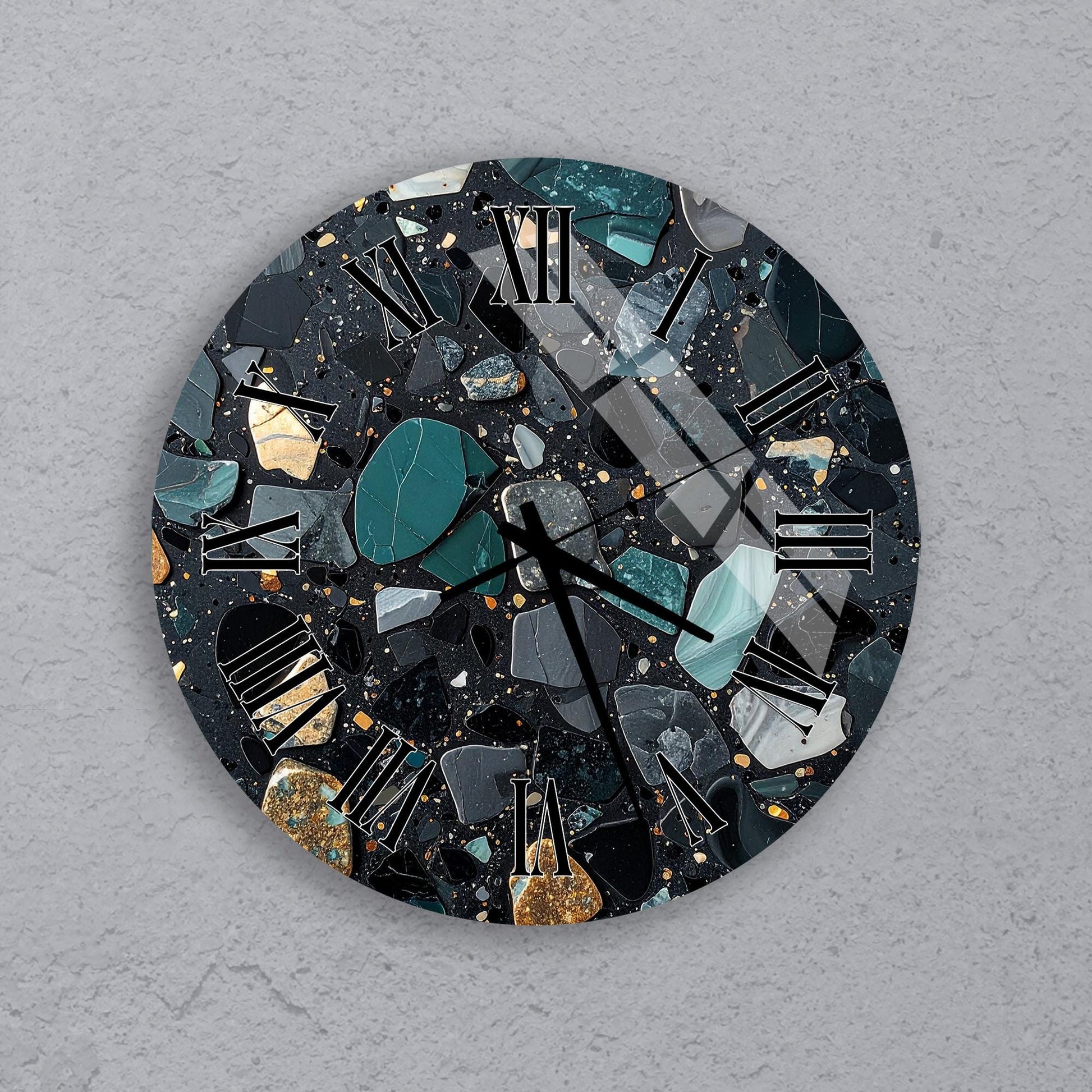 a clock with a mosaic-like design made up of various materials, including black, green, and gold.