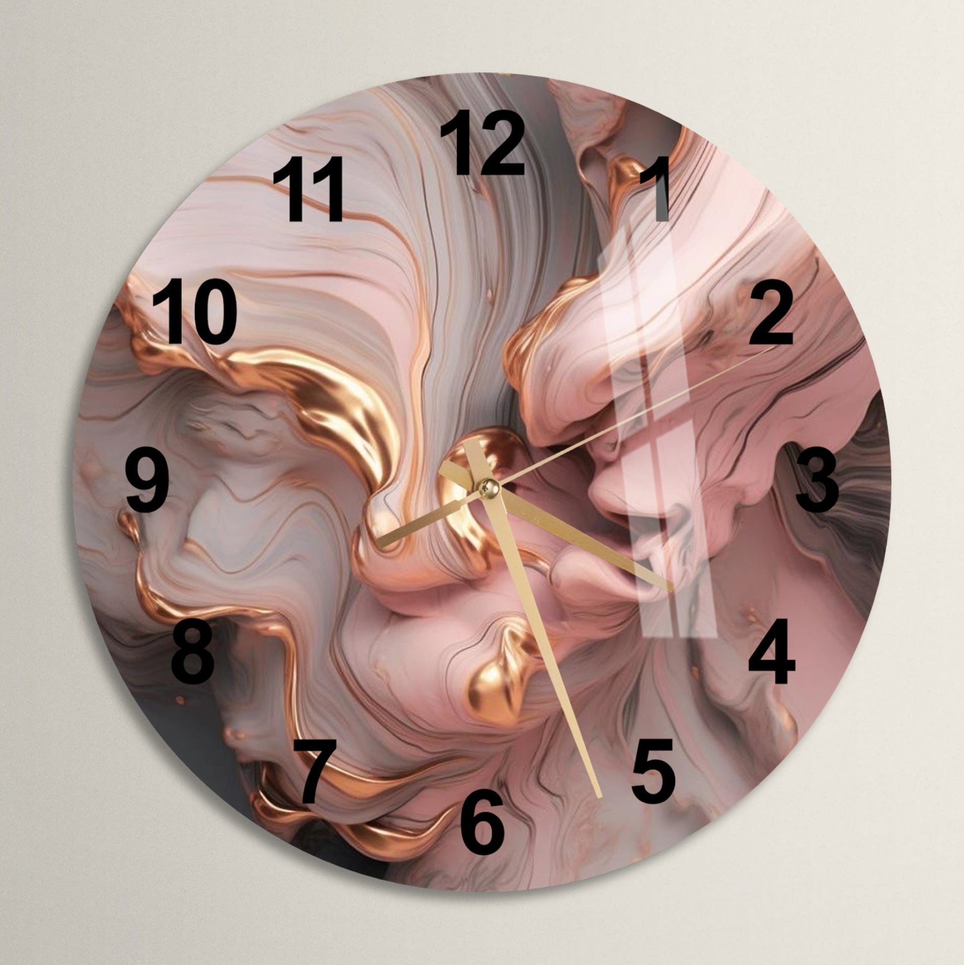 a clock with a pink and gold design on it