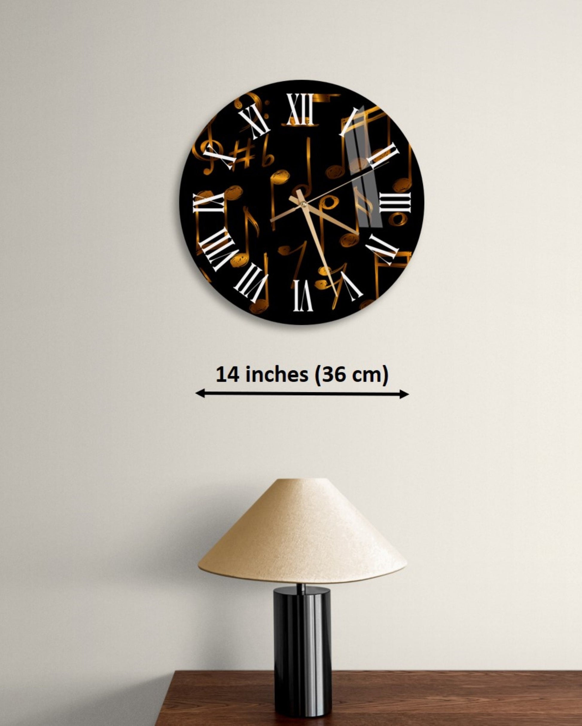 a black and gold clock on a white wall