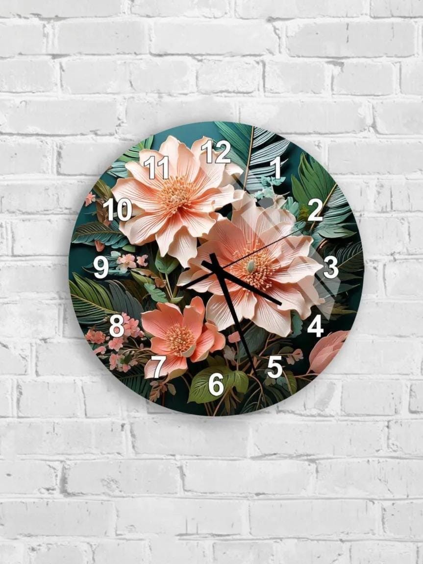 A wall clock with a floral design featuring pink and green flowers and leaves.
