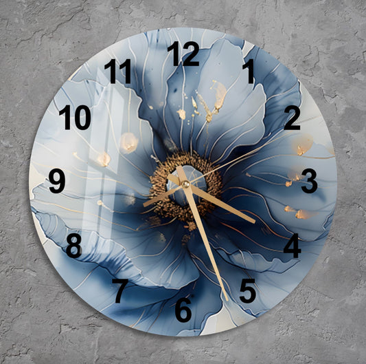 a clock with a blue flower painted on it