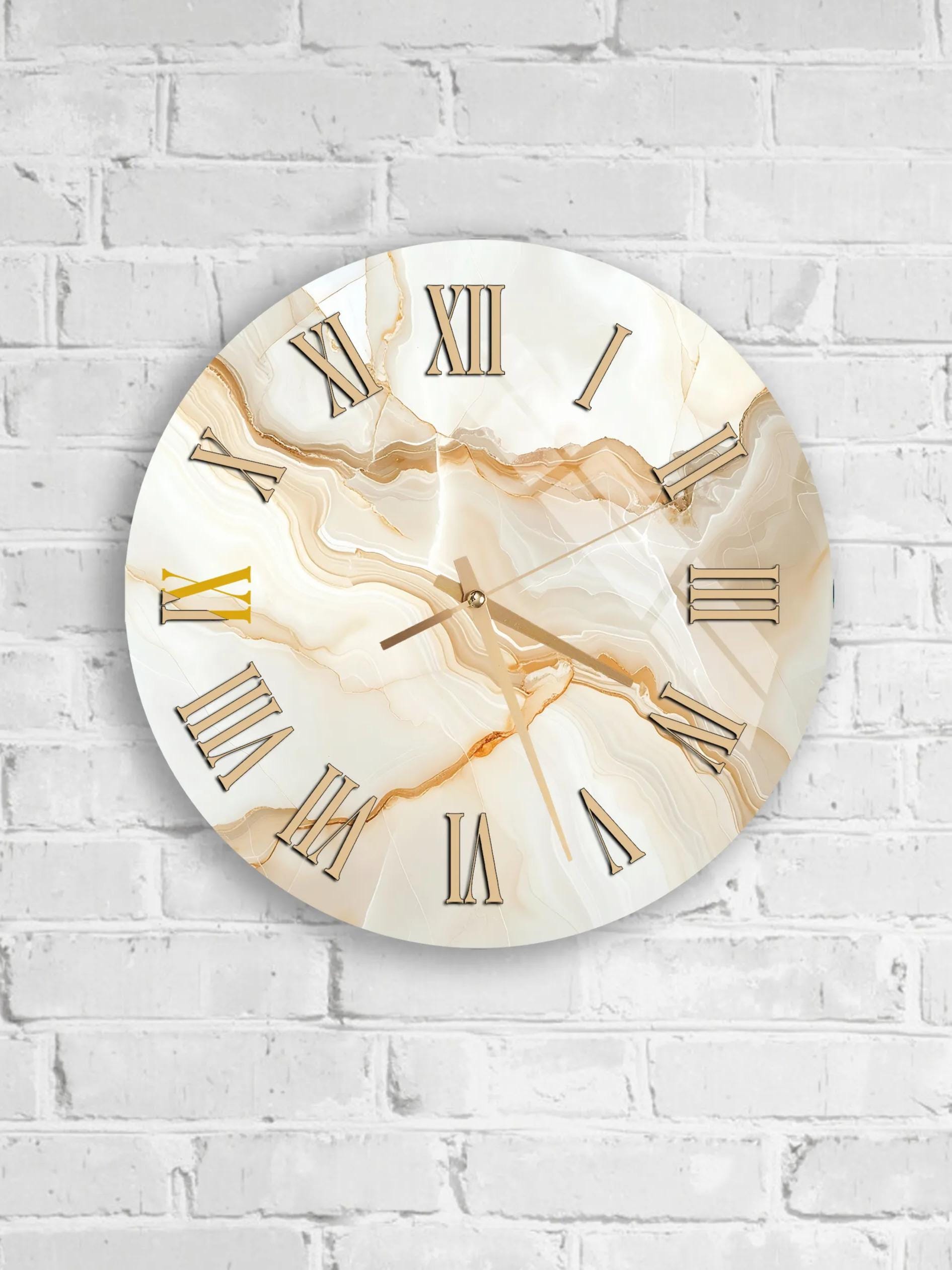 A round wall clock with Roman numerals is mounted on a white brick wall.