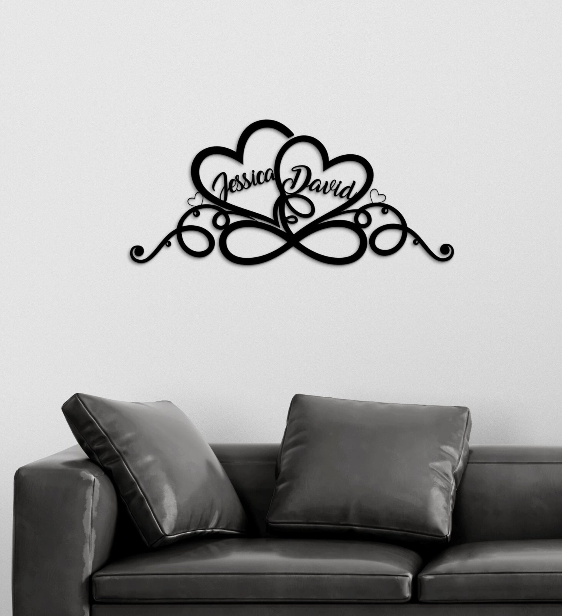 a black and white photo of a couch and a wall