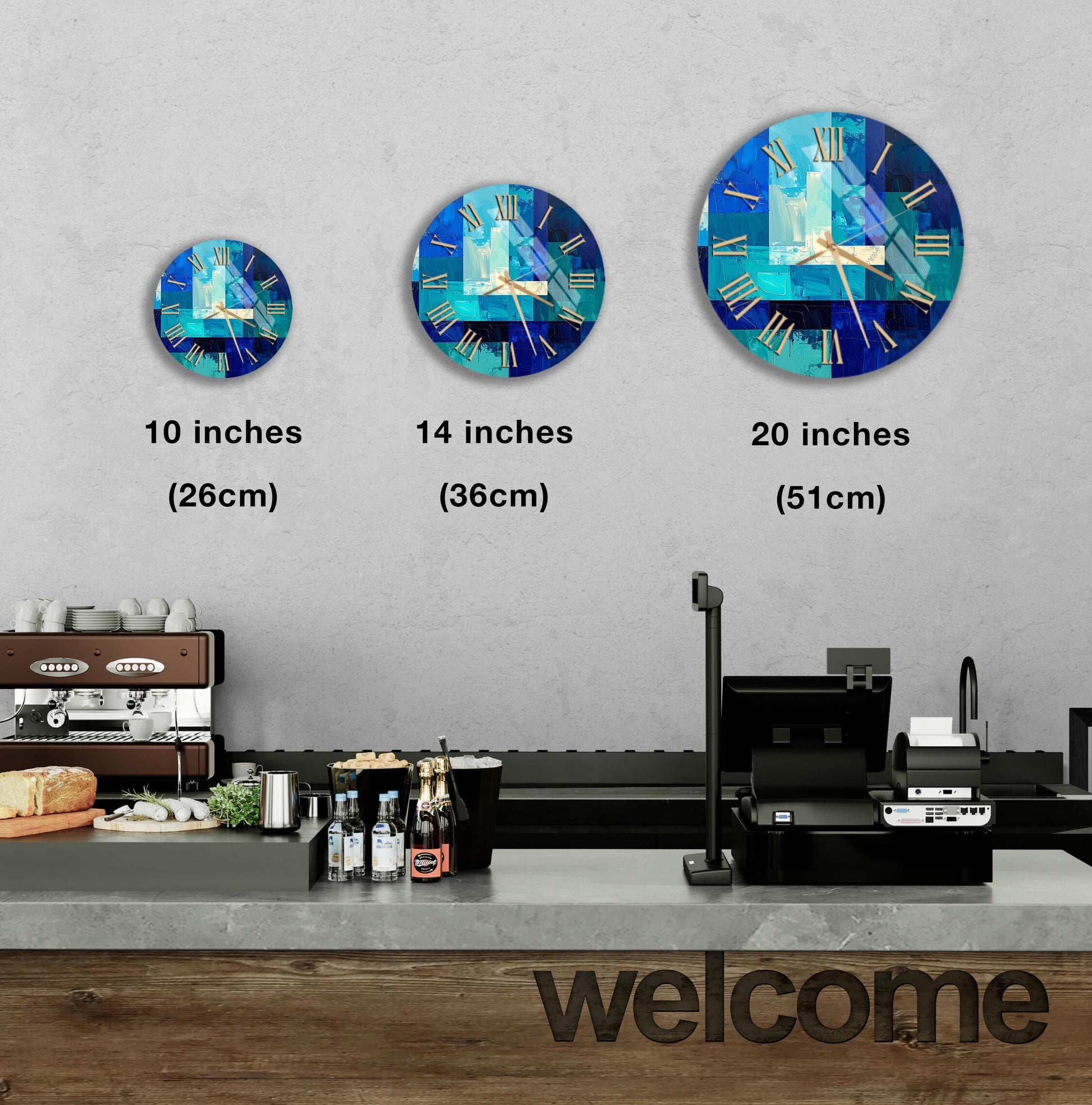 a wall with three clock faces of different sizes, each displaying a different time. Below the clock faces, there is a counter with various items such as bottles and a sandwich. The word "welcome" is written on the counter.
