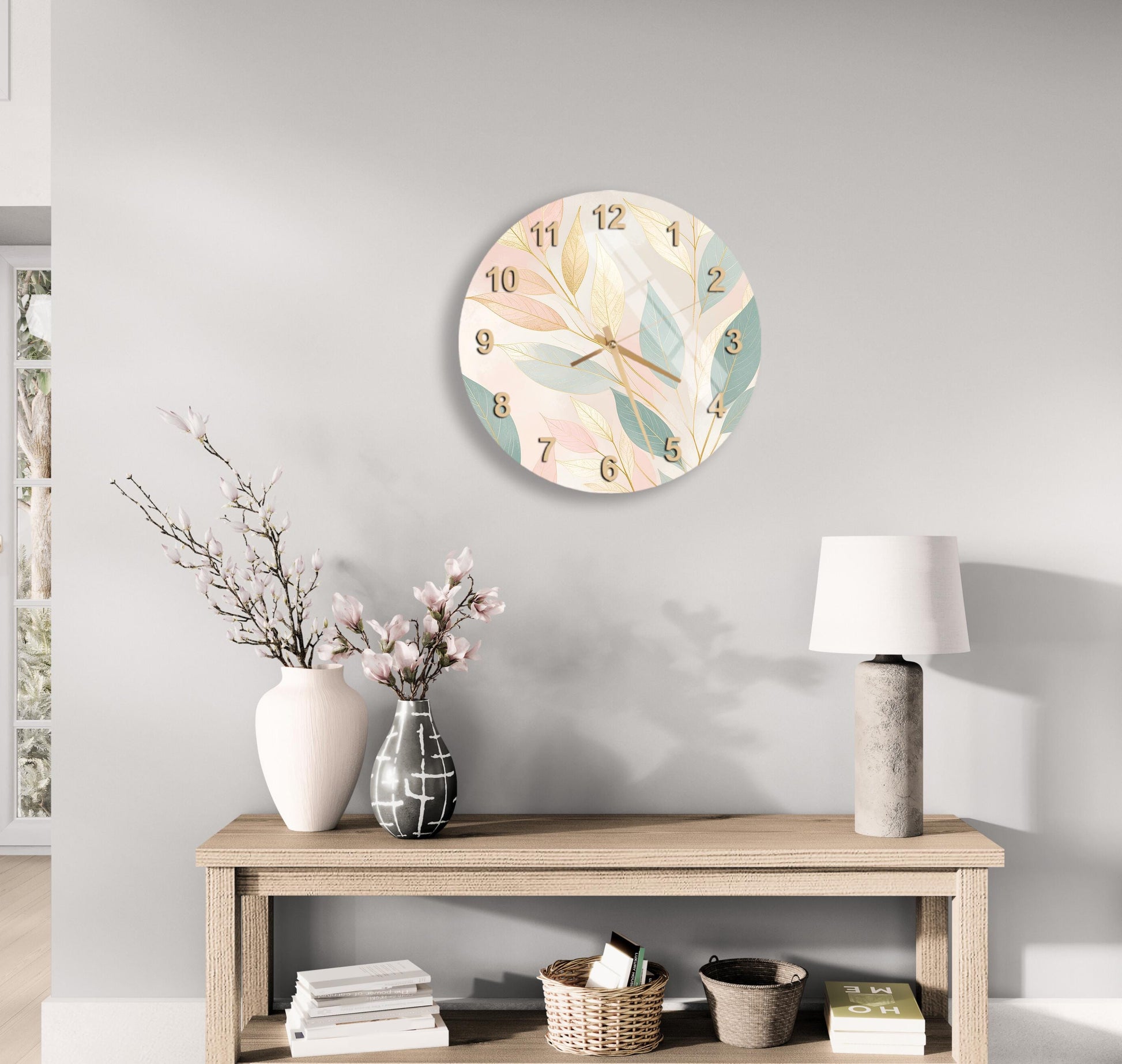 a modern and minimalist living room with a round wall clock displaying the time, a wooden table with a lamp, a vase with flowers, and a stack of books.