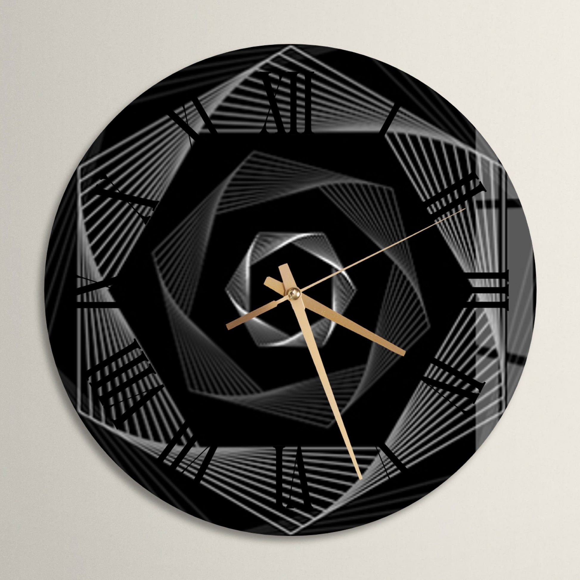 a black and gold clock on a white wall