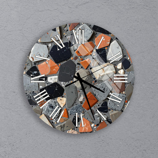 a clock with a mosaic design made up of various colored and shaped stones, creating a visually striking and unique piece of wall art.