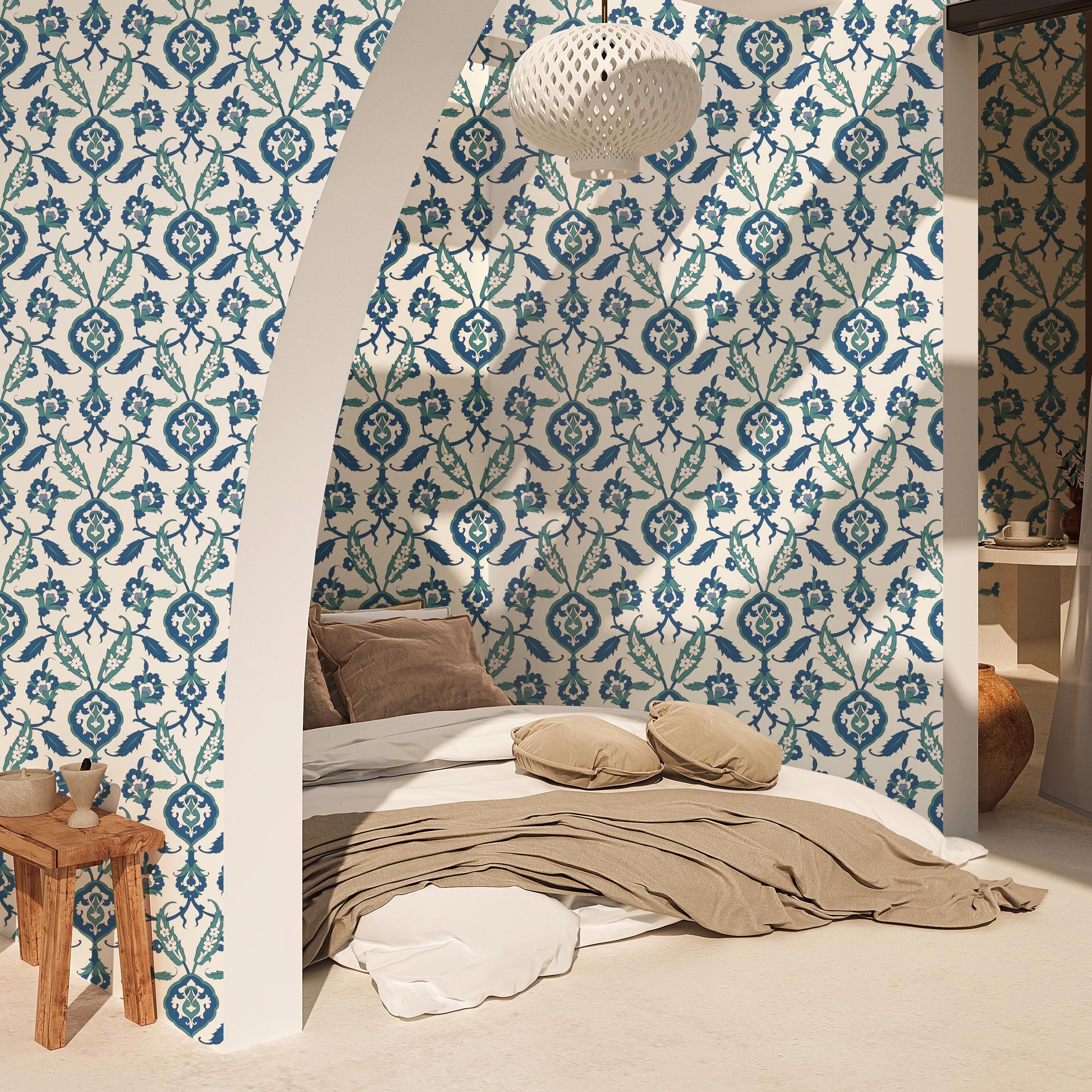 a cozy bedroom with a bed, a wooden stool, and a patterned wallpaper.