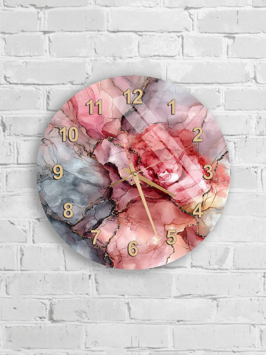 A wall clock with a pink and purple marble design, mounted on a white brick wall.