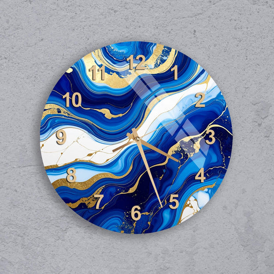 A wall clock with a blue and gold marble design, featuring numbers and hands on a gray background.