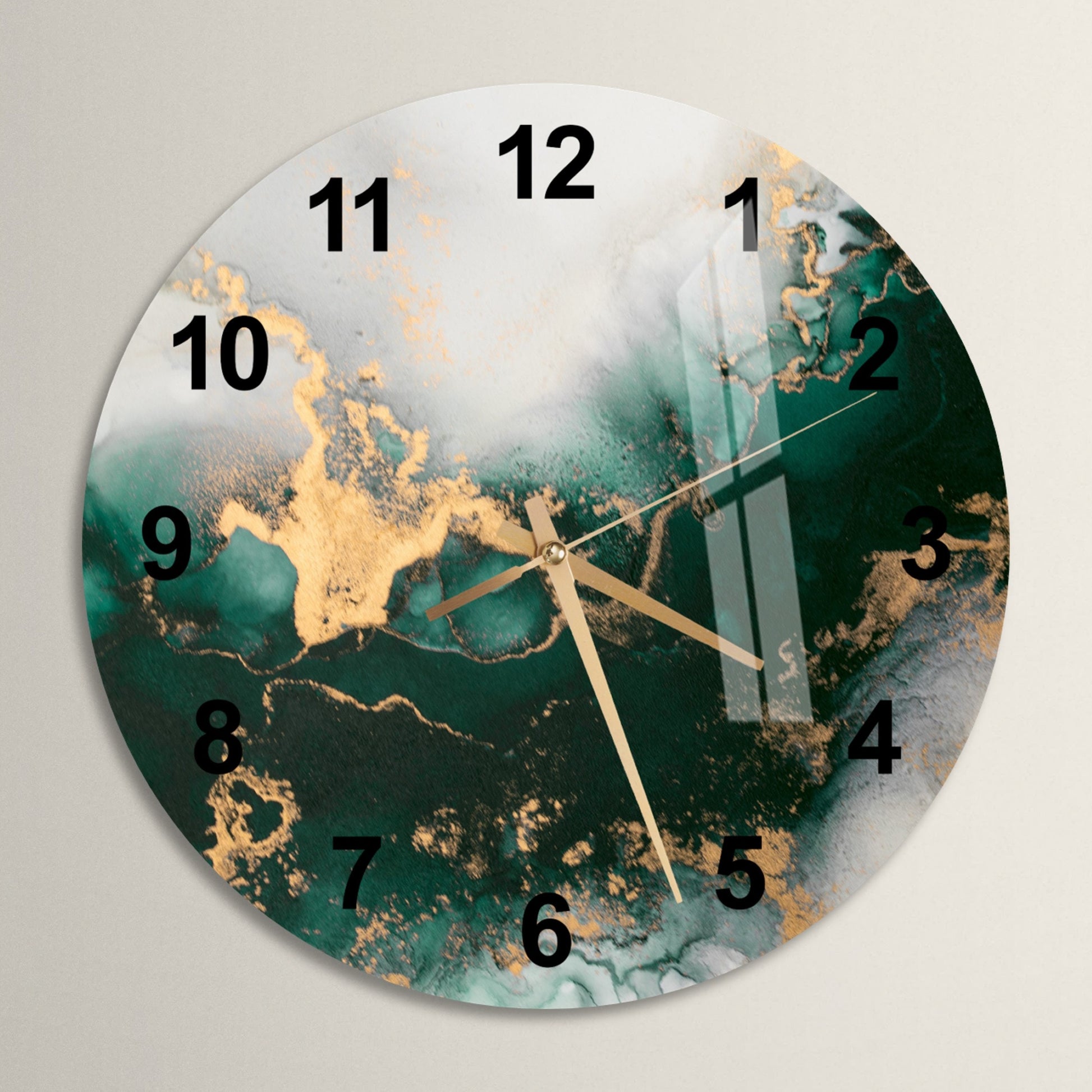 a clock with a green and gold design on it