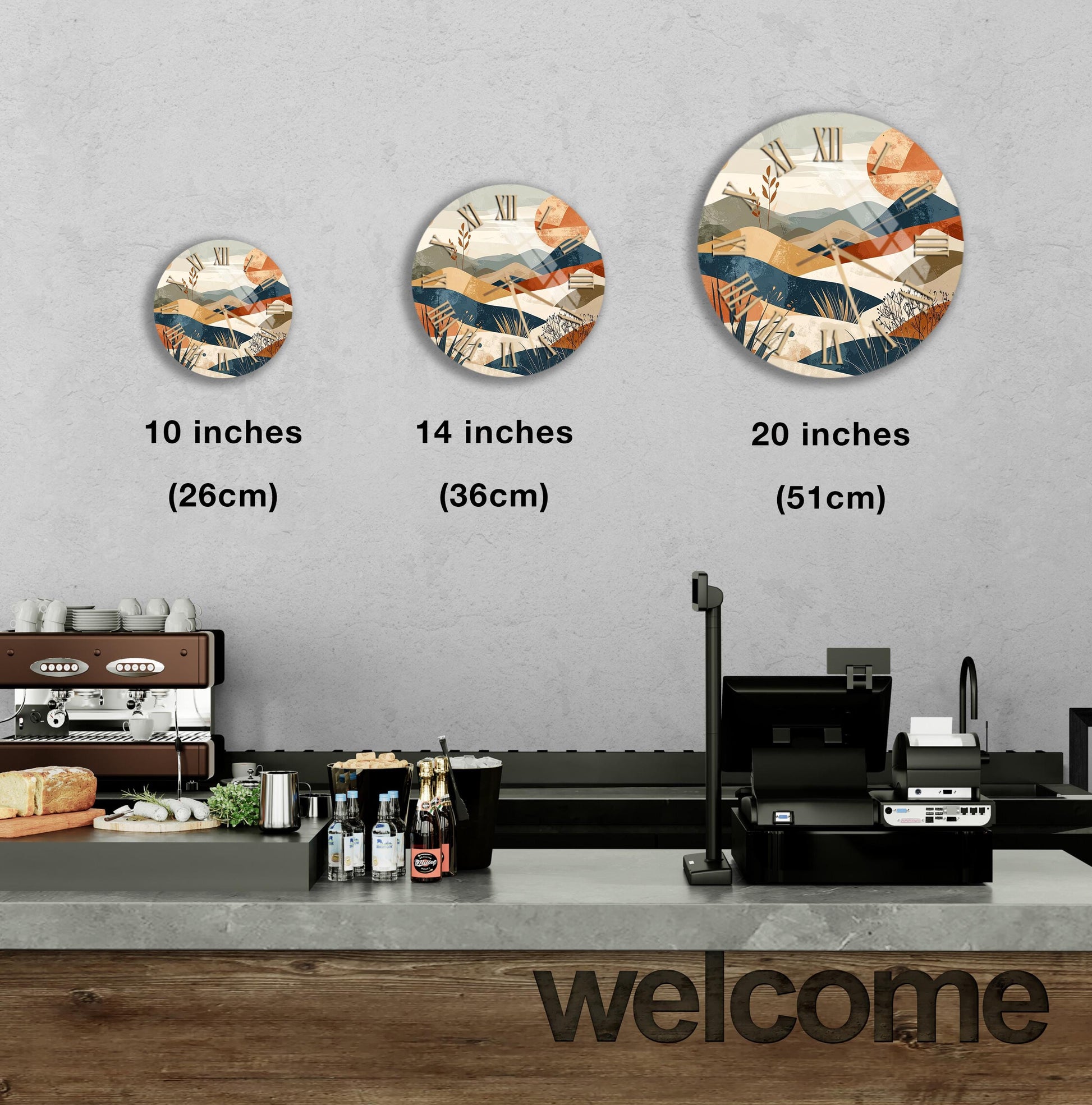 a counter in a restaurant with a coffee machine, bottles, and a welcome sign. There are three clock designs displayed on the wall, each representing a different size.